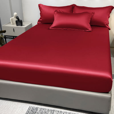 lit avec draps housse rouge