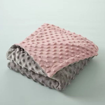 couverture bébé replier montrant deux côtés gris et rose