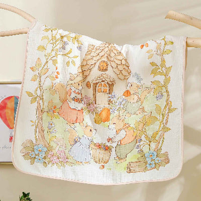 couverture emmaillotage bébé maison suspendue sur pôle