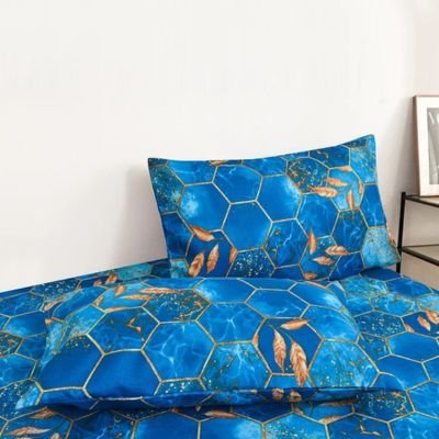 ensemble taie doreiller bleu posé sur lit