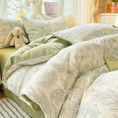 housse de couette verte avec peluche lapin sur lit enfant