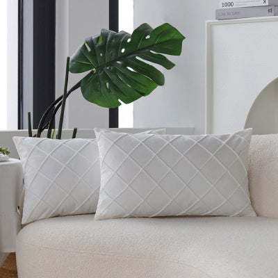 housse de coussin 30x50 blanche superposée sur canapé