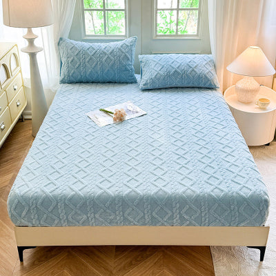 housse de matelas bleue sur lit
