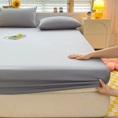 lit avec draps housse gris clair