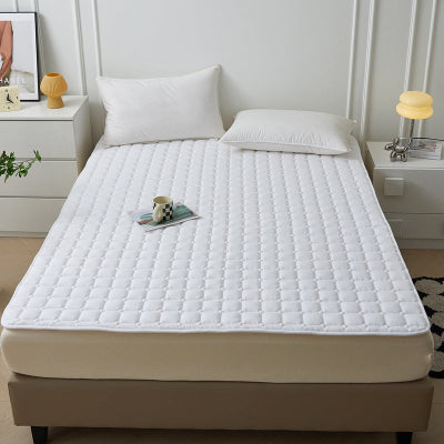 lit avec protection matelas blanc