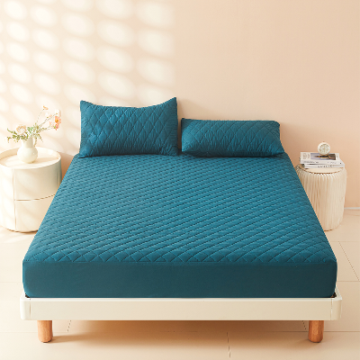 protège matelas imperméable vert sur lit