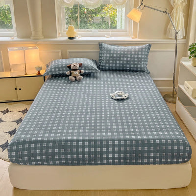 vue lit avec drap housse gris