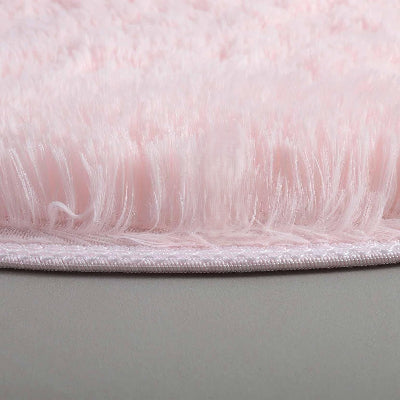 zoom épaisseur tapis rond rose