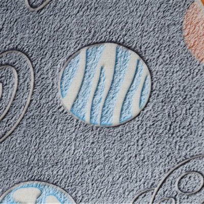 zoom motif planète tapis chambre enfant